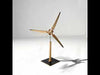 DIY Solar Windmill Kit with pre-cut wooden parts, solar panel, electric motor, and blades mounted on a baseplate. Eco-friendly educational model designed for learning renewable energy through hands-on assembly.