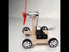 Air-Powered Aerodynamic Car STEM Science Kit – Wooden model car with DC motor, fan, and user manual showing step-by-step air propulsion assembly and learning for kids.