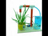DIY Auto Flower Watering System kit with soil sensor, water pump, tubing, control board, and plant pot for learning automation and irrigation.
