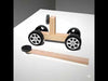 DIY Magnetic Car Toy kit with wooden base, plastic wheels, magnets, and axle rods designed for 7th class science projects to demonstrate magnetism and motion.