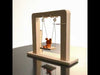 Assembled DIY Electromagnetic Swing Kit showing moving metal swing